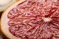 Close-up view of fresh textured grapefruit halved cross section