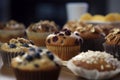 A close-up view of freshly baked muffins with a variety of flavors and toppings.Â 