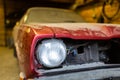 Close-up view front side classic car, front headlight of a broken dusty car during road accident and has been