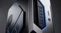 A close-up view of a futuristic computer tower with blue LED lights illuminating the front panel in a grid pattern, showcasing Royalty Free Stock Photo
