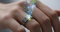 Close up view of futuristic smart ring projecting digital interface onto user hand, innovative technology for seamless interaction Royalty Free Stock Photo
