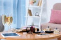close-up view of gadgets, glasses of champagne and various cosmetics on table Royalty Free Stock Photo