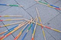 Close-up view of the game of pick-a-stick, commonly known as jackstraws, set up on a city street Royalty Free Stock Photo