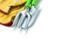 Close up view garden fork and hand spade on gloves isolated white Royalty Free Stock Photo