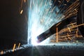 Close up view gas metal arc welding (GMAW) process with sparks, light and smoke. It is a high-speed, economical process