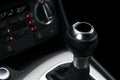 Close up view of a gear lever shift. Manual gearbox. Car interior details. Car transmission. Soft lighting. Abstract view. Car det Royalty Free Stock Photo