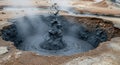 Geothermal Mud Pool Erupting with Bubbling Grey Mud and Steam in Iceland image photo Royalty Free Stock Photo