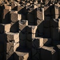 Natural hexagonal basalt columns illuminated by sunlight creating dramatic shadows Royalty Free Stock Photo