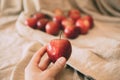 Close up view of girl holding red apple in hand. Organic fruit. Royalty Free Stock Photo