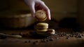 Close up view of a girl picking coffee macaron from black plate