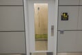 Close-up view of glass door to room for pet relief at airport. USA. Royalty Free Stock Photo
