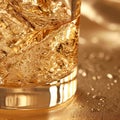 Close up view of a glass of whisky with golden bokeh background