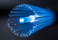 A close-up view of a glowing fiber optic cable bundle with a sleek, Royalty Free Stock Photo