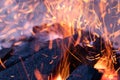 Close up view of glowing flying sparks hot fire flame Royalty Free Stock Photo