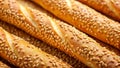 Close-up view of golden brown breadsticks, generously sprinkled with sesame seeds, arranged in an appealing pattern. Generative AI
