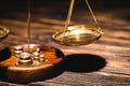 Close up view of golden scales of justice on wooden table Royalty Free Stock Photo