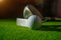 Close-up view of golf ball on the green grass. Royalty Free Stock Photo