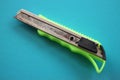 Close up view of green cardboard cutter Royalty Free Stock Photo