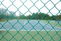 Close up view of a green chain link fencing