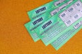 Close up view of green lottery scratch cards. Many used fake instant lottery tickets with gambling results. Gambling addiction Royalty Free Stock Photo