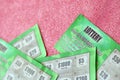 Close up view of green lottery scratch cards. Many used fake instant lottery tickets with gambling results. Gambling addiction Royalty Free Stock Photo