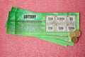 Close up view of green lottery scratch cards. Many used fake instant lottery tickets with gambling results. Gambling addiction Royalty Free Stock Photo