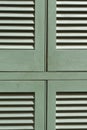 A close up view of a green louvred shutters in Corfu Royalty Free Stock Photo