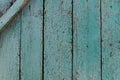 Close-up view of green painted pale and worn hardwood planks surface as background image. Abstract background