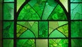 Green stained glass window with arched and geometric patterns Royalty Free Stock Photo