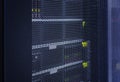 Close up view grid door of modern mainframe in high tech internet data center abstract . Server hardware, networking