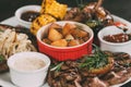 close-up view of grilled vegetables, roasted chicken wings and beef steaks with potatoes on plate Royalty Free Stock Photo