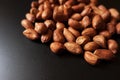 Close up view of groundnuts groups on black background Royalty Free Stock Photo