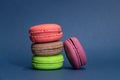 Group of colourful macarons on blue background