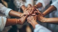 Close-up view of a group of diverse hands placed one on top of the other in a stack. AI generated Royalty Free Stock Photo