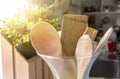 Close-up view of a group of wooden kitchen utensils inside a glass container