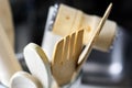 Close-up view of a group of wooden kitchen utensils. Selective focus on the fork Royalty Free Stock Photo