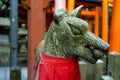 Close-up view of guardian Fox stone statue in Fushimi Inari-Taisha Shinto Shrine in Kyoto, Japan. Royalty Free Stock Photo