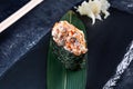 Close up view on gunkan sushi with spicy sauce and eel on dark stone background. Fresh Japanese cuisine. asian food. Sushi image Royalty Free Stock Photo