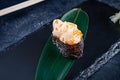 Close up view on gunkan sushi with spicy sauce and scallop on dark stone background. Fresh Japanese cuisine. asian food. Sushi Royalty Free Stock Photo