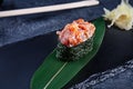 Close up view on gunkan sushi with spicy sauce and tuna on dark stone background. Fresh Japanese cuisine. asian food. Sushi image Royalty Free Stock Photo