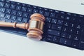 Close up view of a hammer and a computer keyboard Royalty Free Stock Photo