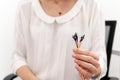 Doctor holding electrodes for biofeedback therapy