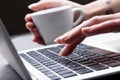 Close up view of the hand of a female typist