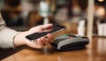 Mobile phone, touch a credit card reader on the counter bar. Royalty Free Stock Photo