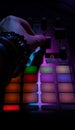 Close-up view of hand moving faders on deejay controller, professional controller with faders and knobs, music Royalty Free Stock Photo