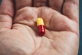 close-up view of a hand a pill Royalty Free Stock Photo