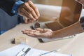 Close up view hand of property realtor / landlord giving key house to buyer / tenant Royalty Free Stock Photo