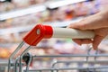 A hand with pushcart in supermarket Royalty Free Stock Photo