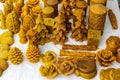 A close up view of hand sculpted wax candles on a stall during a local craft fair.