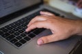 Close up view of hand typing on a laptop keyboard Royalty Free Stock Photo